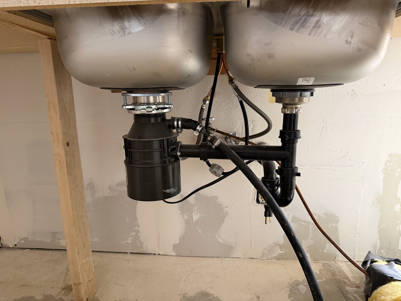 Disposal, P-trap, and braided supply lines left connected under a sink during a cabinet replacement
