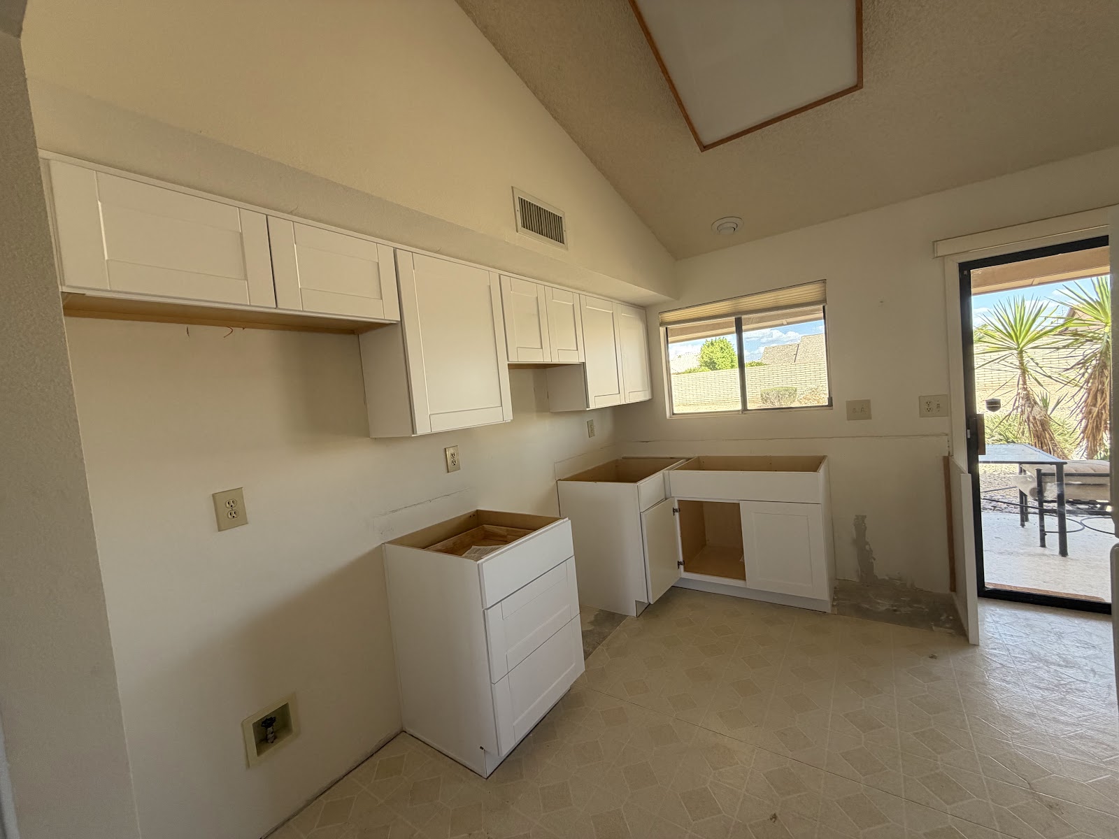 Finished satin white Shaker kitchen cabinet installation in Sun City West, AZ