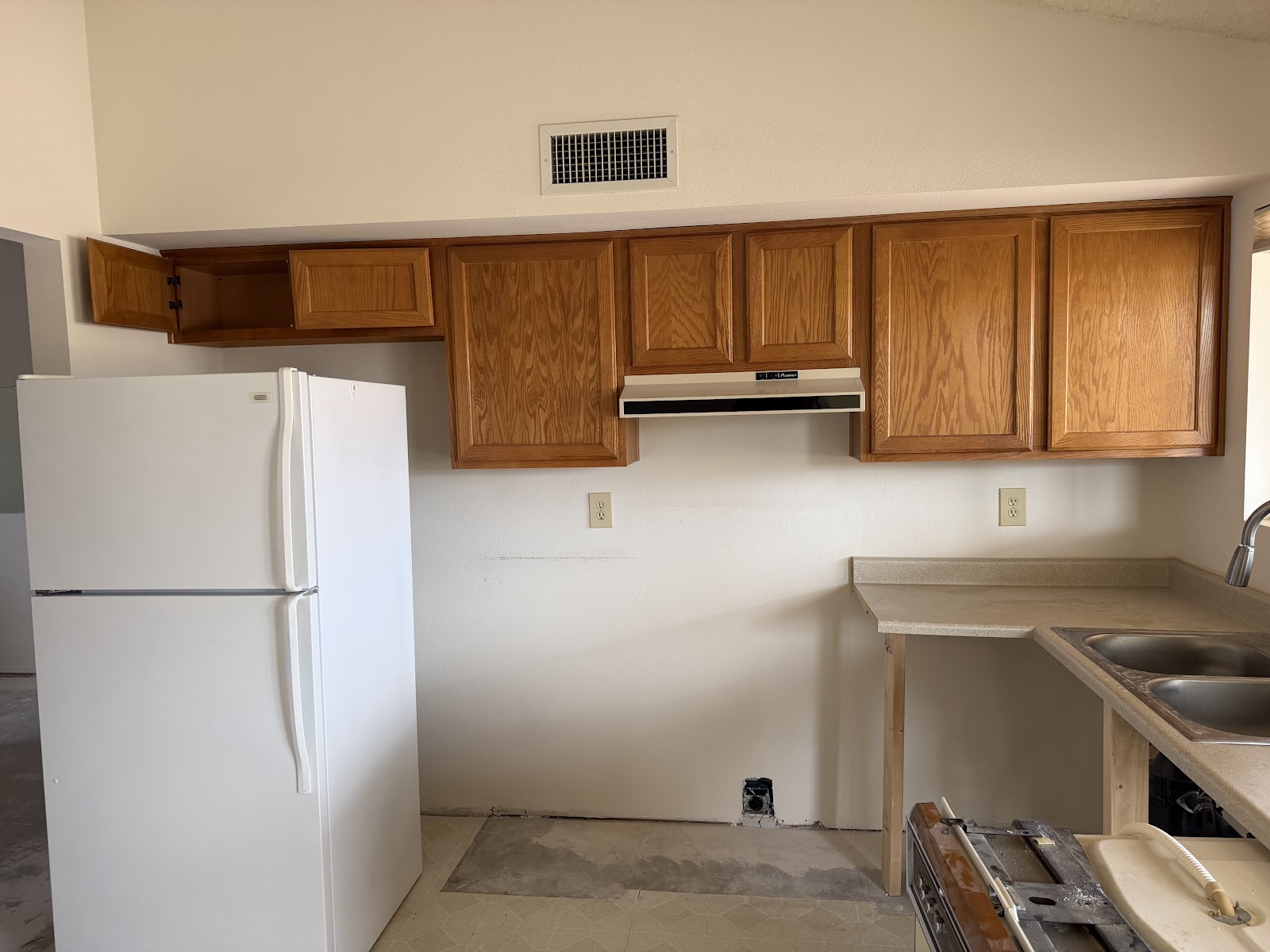 Dated golden oak kitchen cabinets that are the classic refacing candidate in a Phoenix home