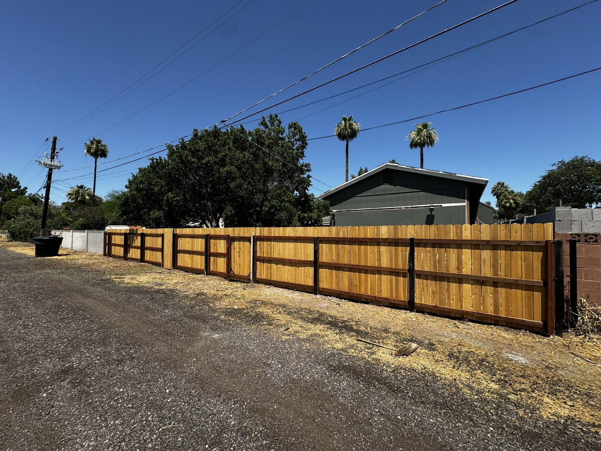 New cedar dog-ear privacy fence along a backyard alley in Tempe AZ