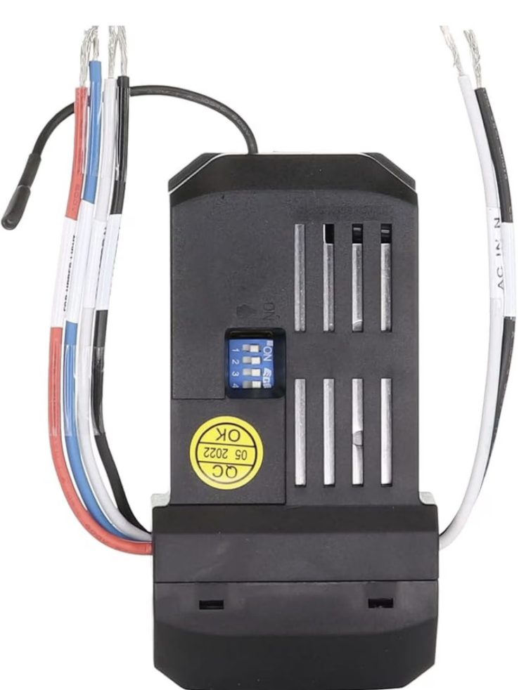 Ceiling fan receiver module with its matching DIP switch block, set to the same code as the remote before mounting