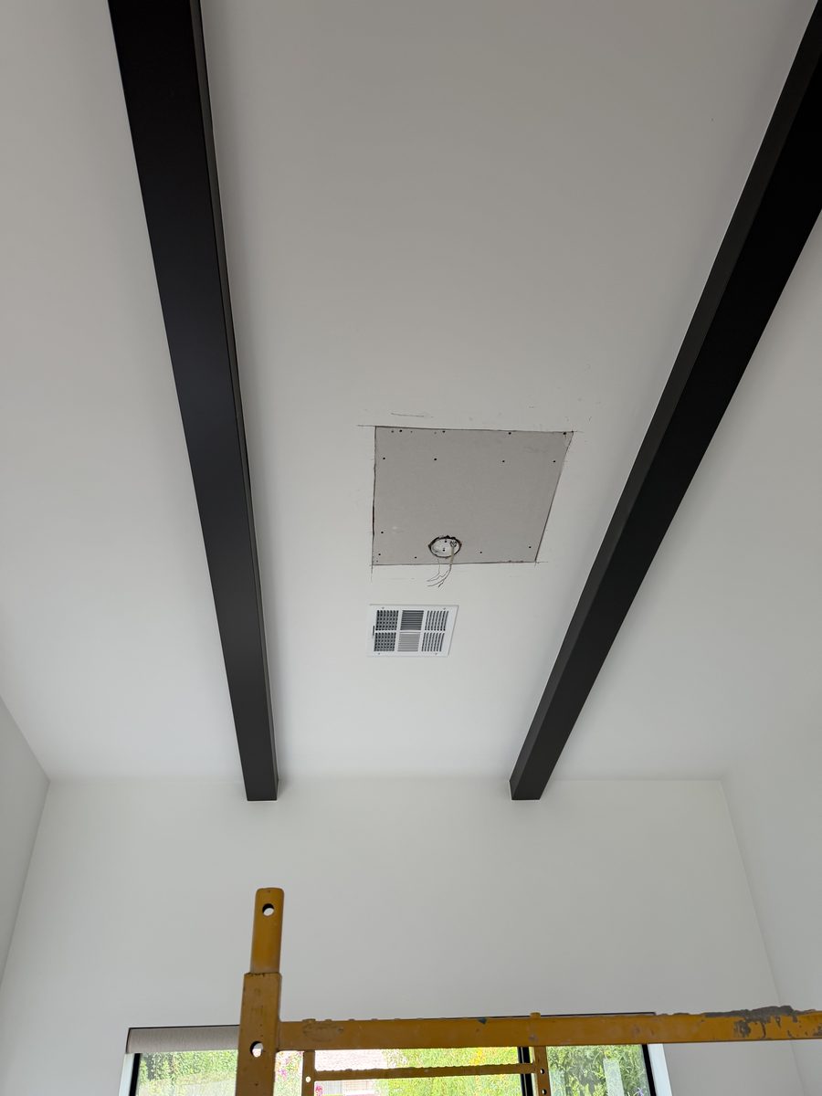 Drywall patch cut square to fit the ceiling opening and screwed off to new blocking, with the fixture wire pulled through