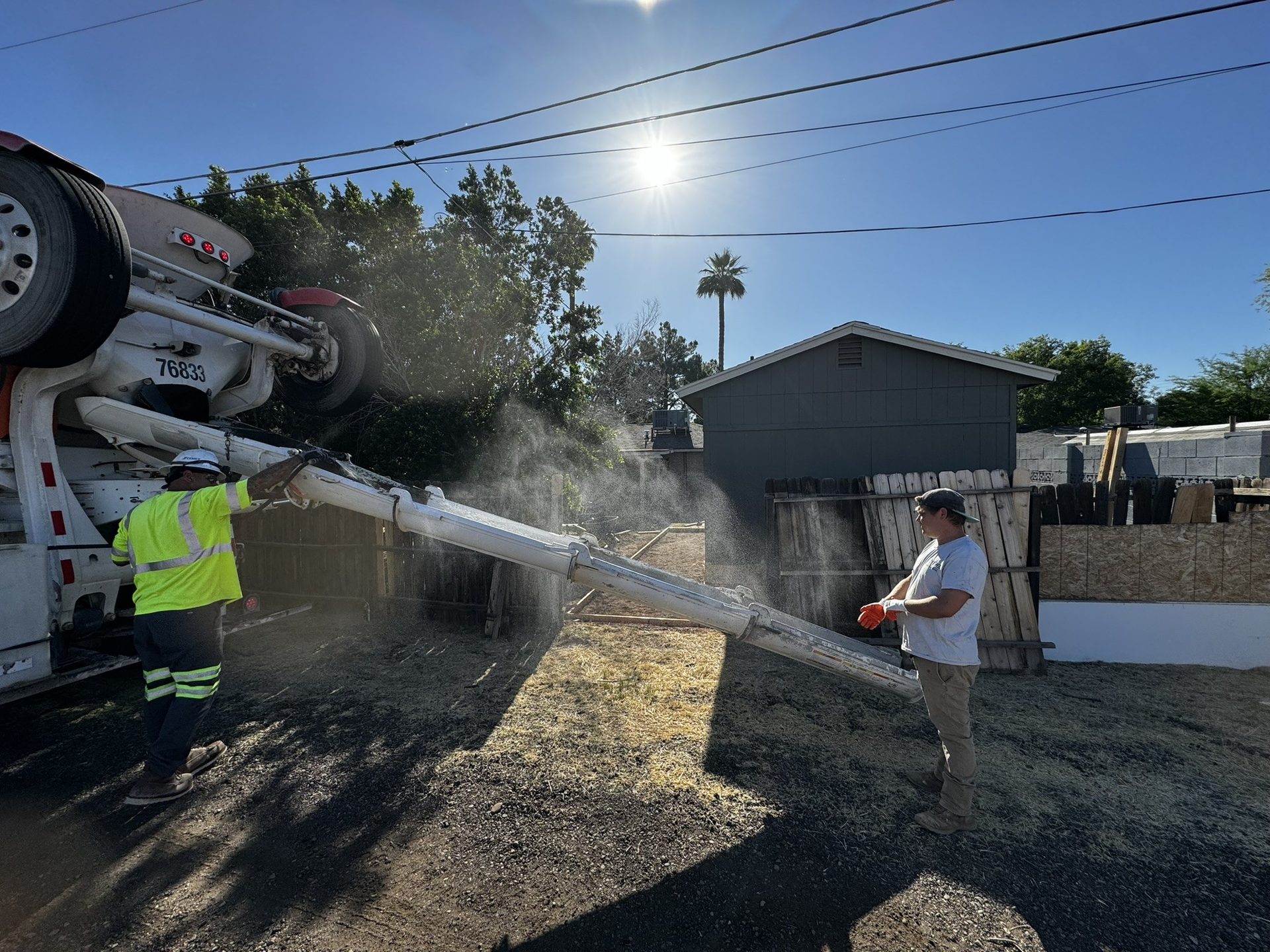 Norem Contracting crew pouring a new concrete patio at a Tempe guest house