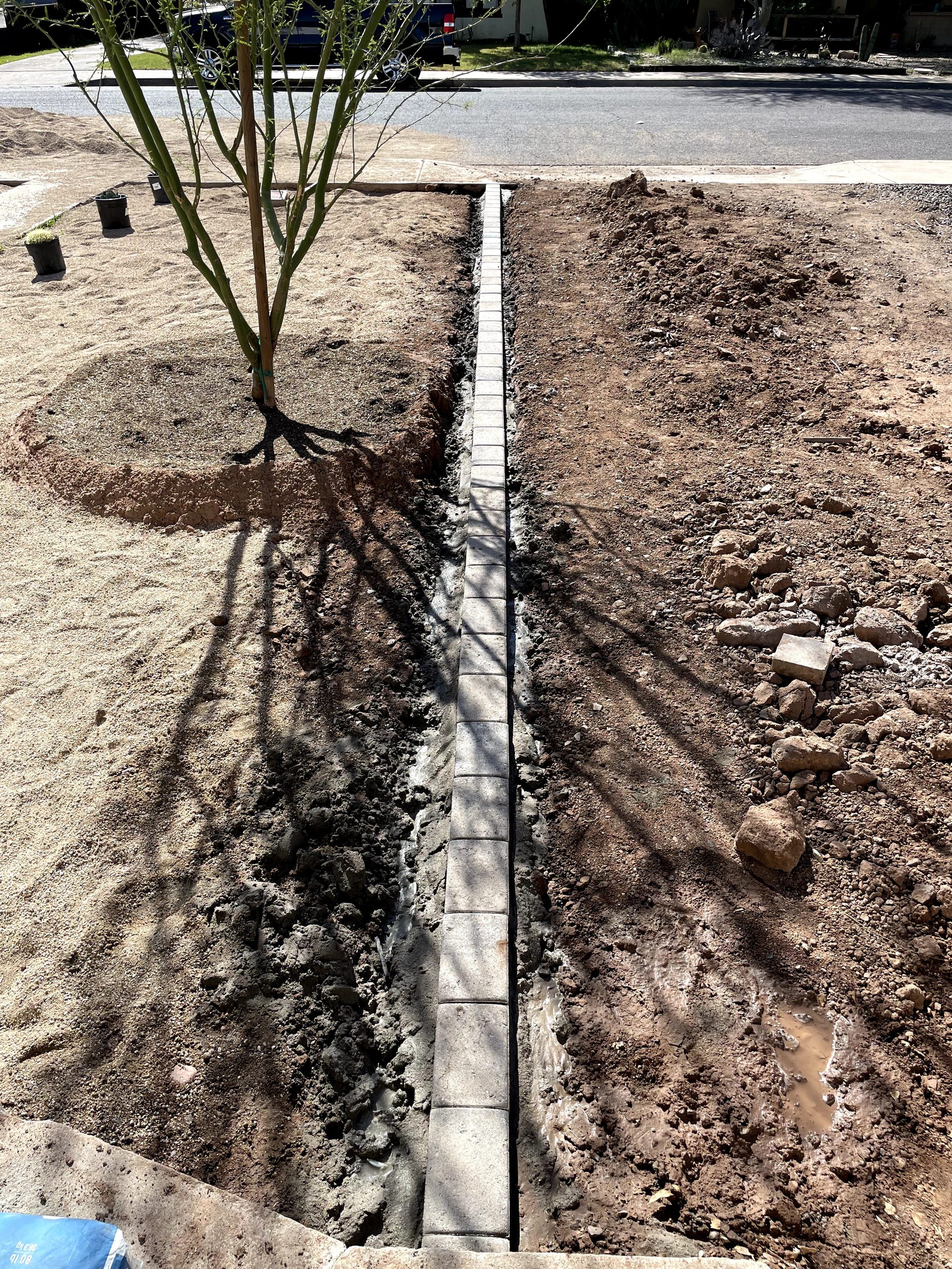 New concrete front walkway with paver-style edge banding at a Phoenix historic bungalow