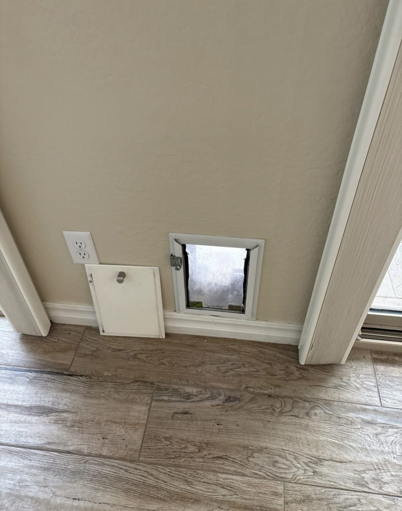 Before: Old pet door interior side with flap removed Phoenix AZ