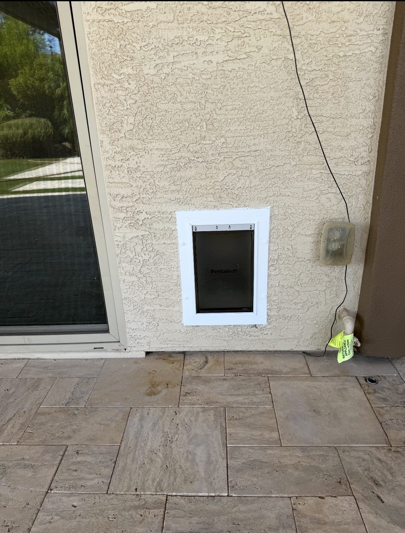 After: New dog door sealed into exterior stucco wall Phoenix AZ