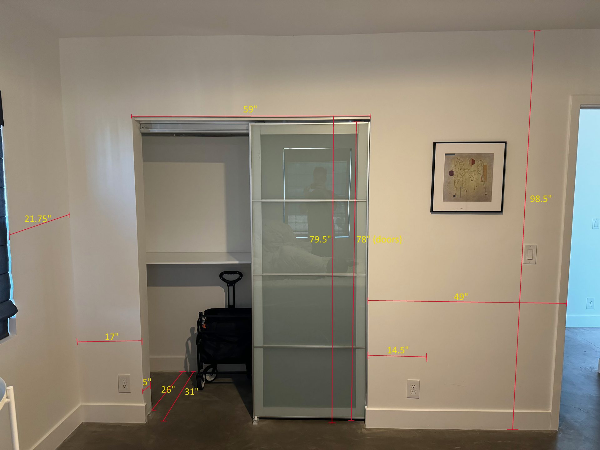 Bedroom sliding-door closet measured for a new stacked washer and dryer hookup in Phoenix