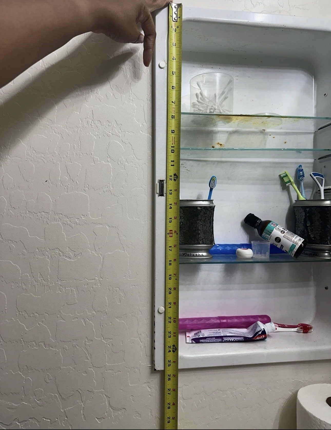 Before: Old recessed medicine cabinet being measured Phoenix AZ