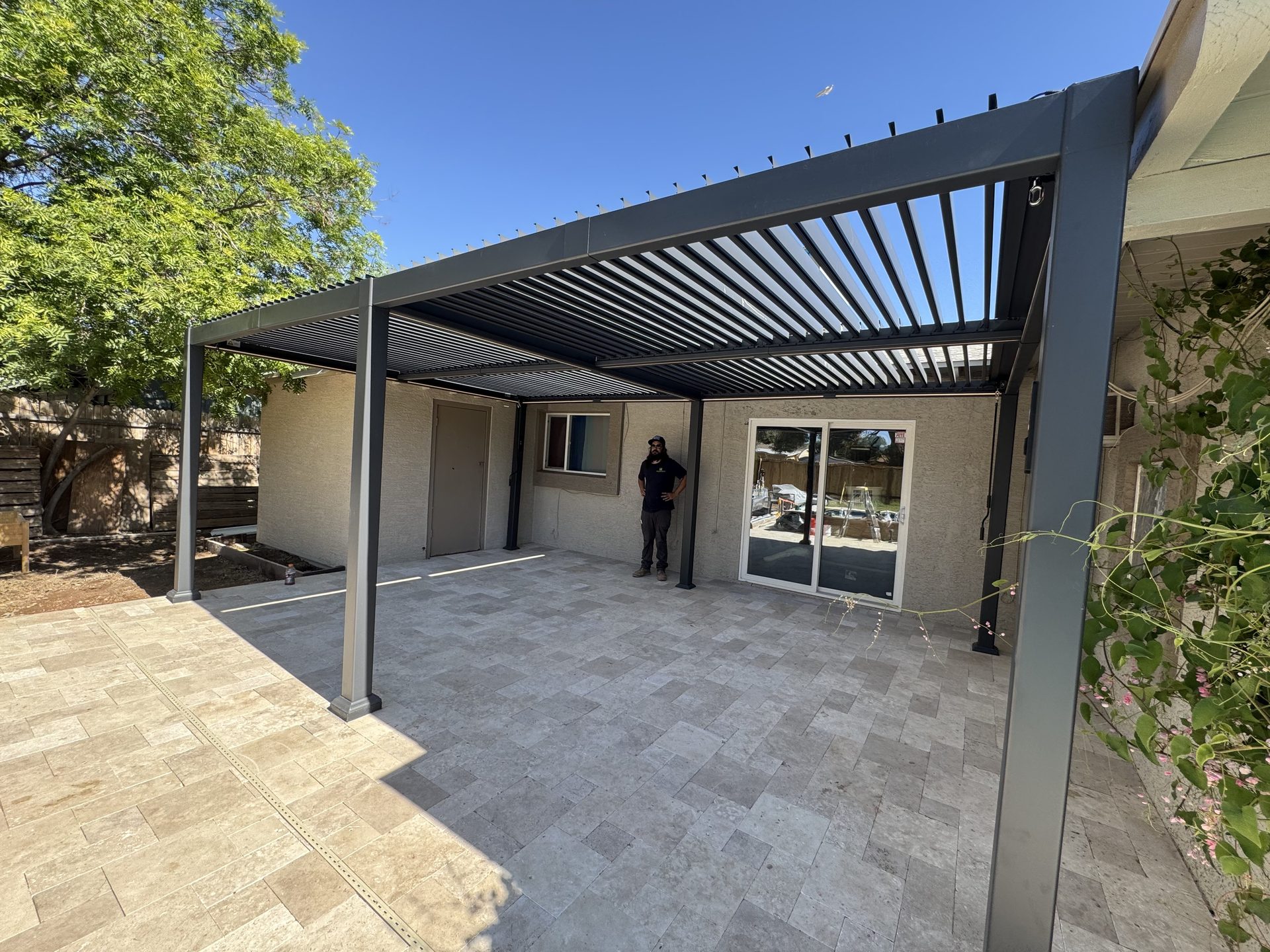 Adjustable louvered pergola roof over a Phoenix patio