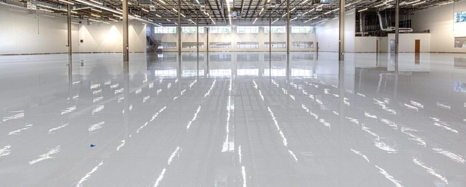Cured high gloss epoxy floor coating in a large open interior