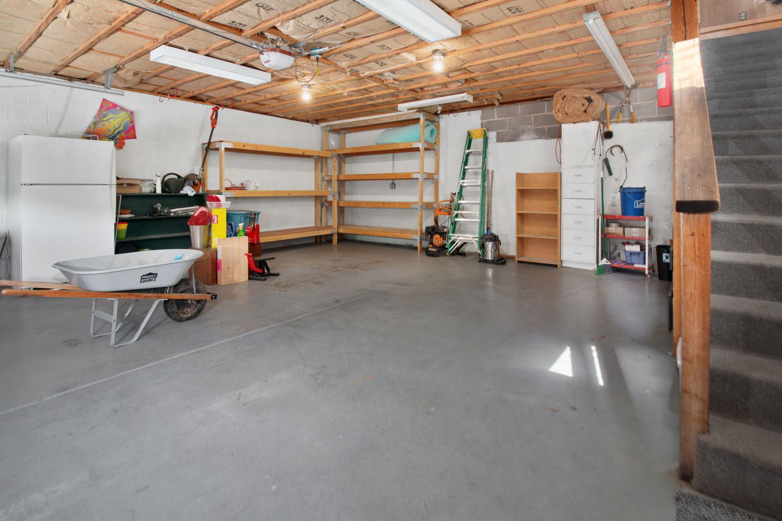 Bare uncoated concrete garage slab before floor coating preparation
