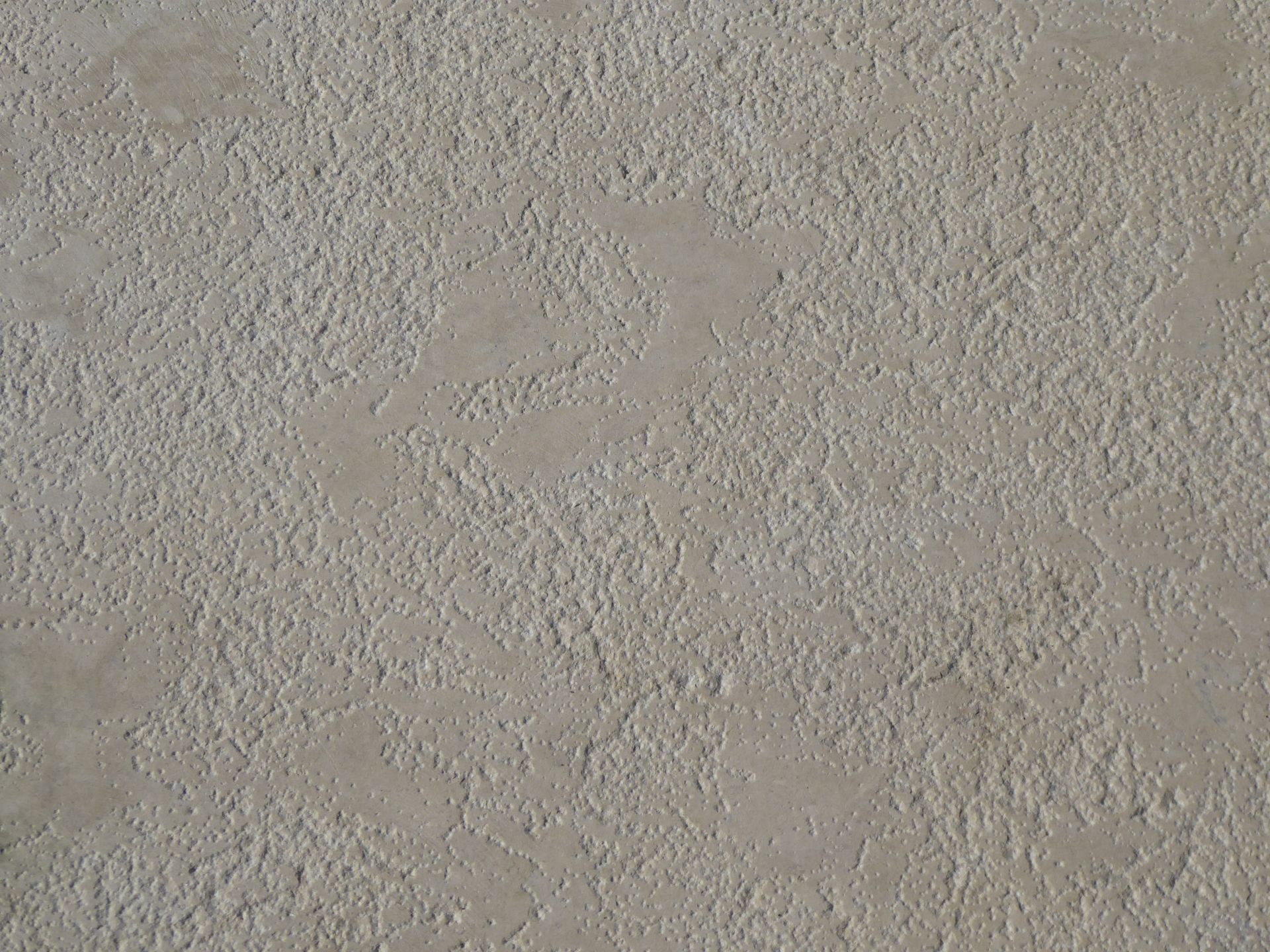 Marmorino style interior plaster surface in a warm neutral with a fine matte stone texture