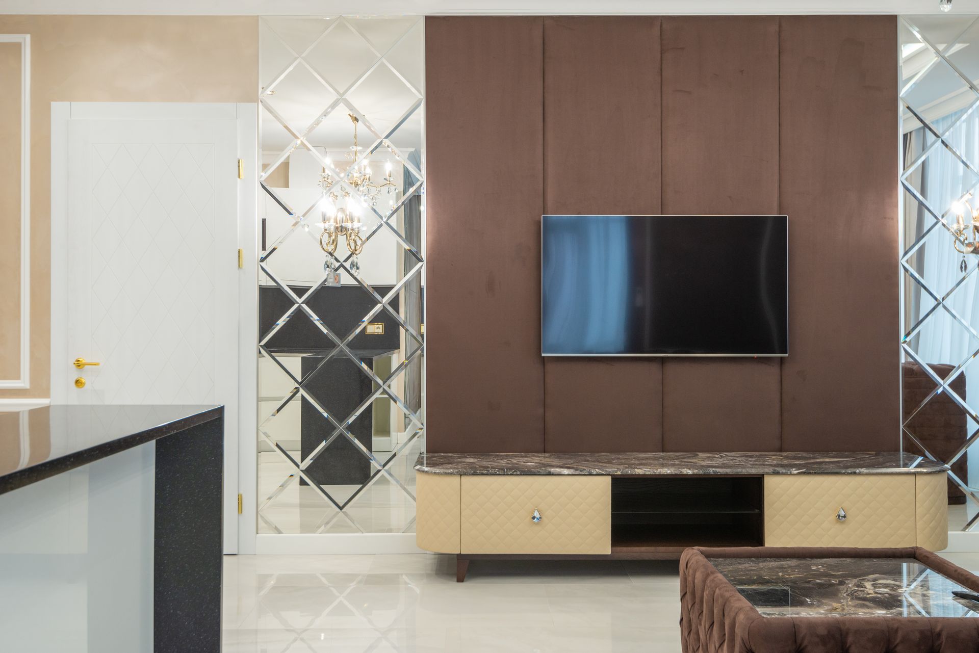 Living space with a textured plaster feature wall behind a media console