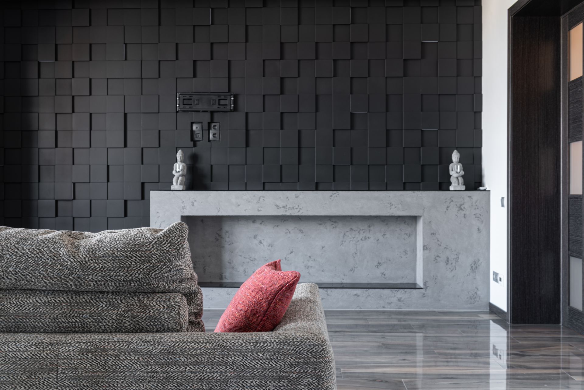 Living room with a hand troweled plaster accent wall in a warm neutral tone