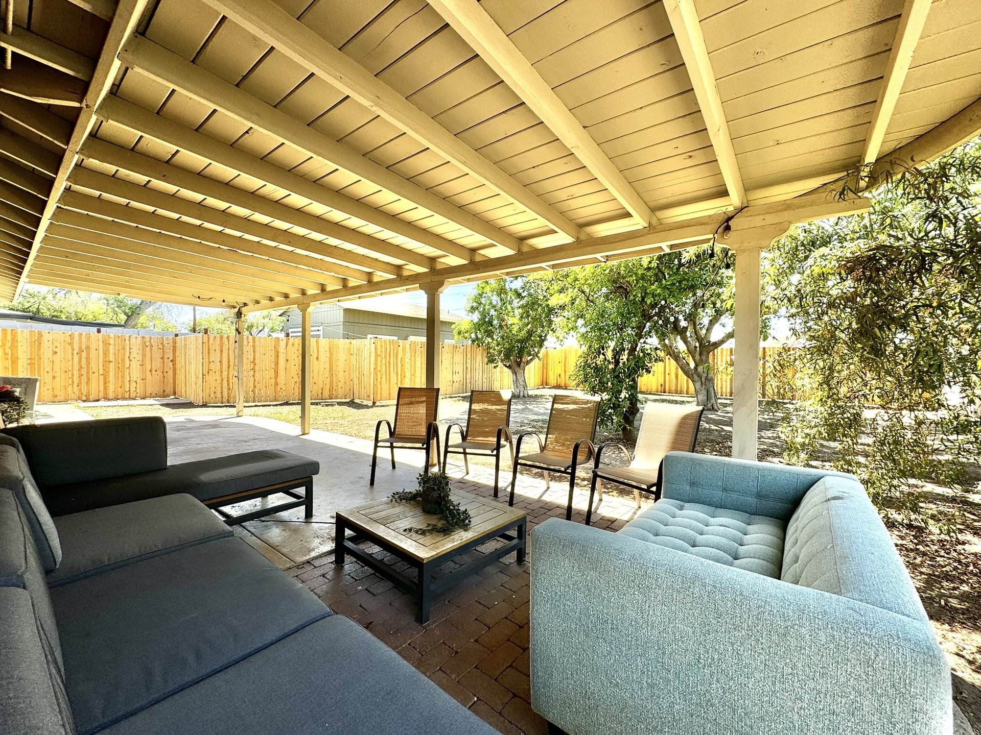 Covered patio looking out onto a new cedar privacy fence in a Tempe backyard