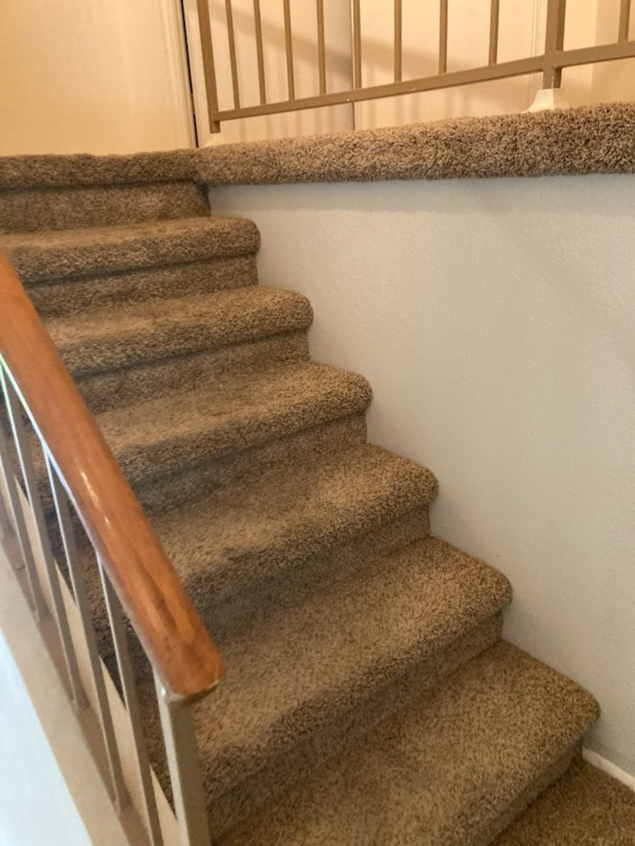 Before: carpeted staircase and landing before vinyl plank conversion Phoenix AZ